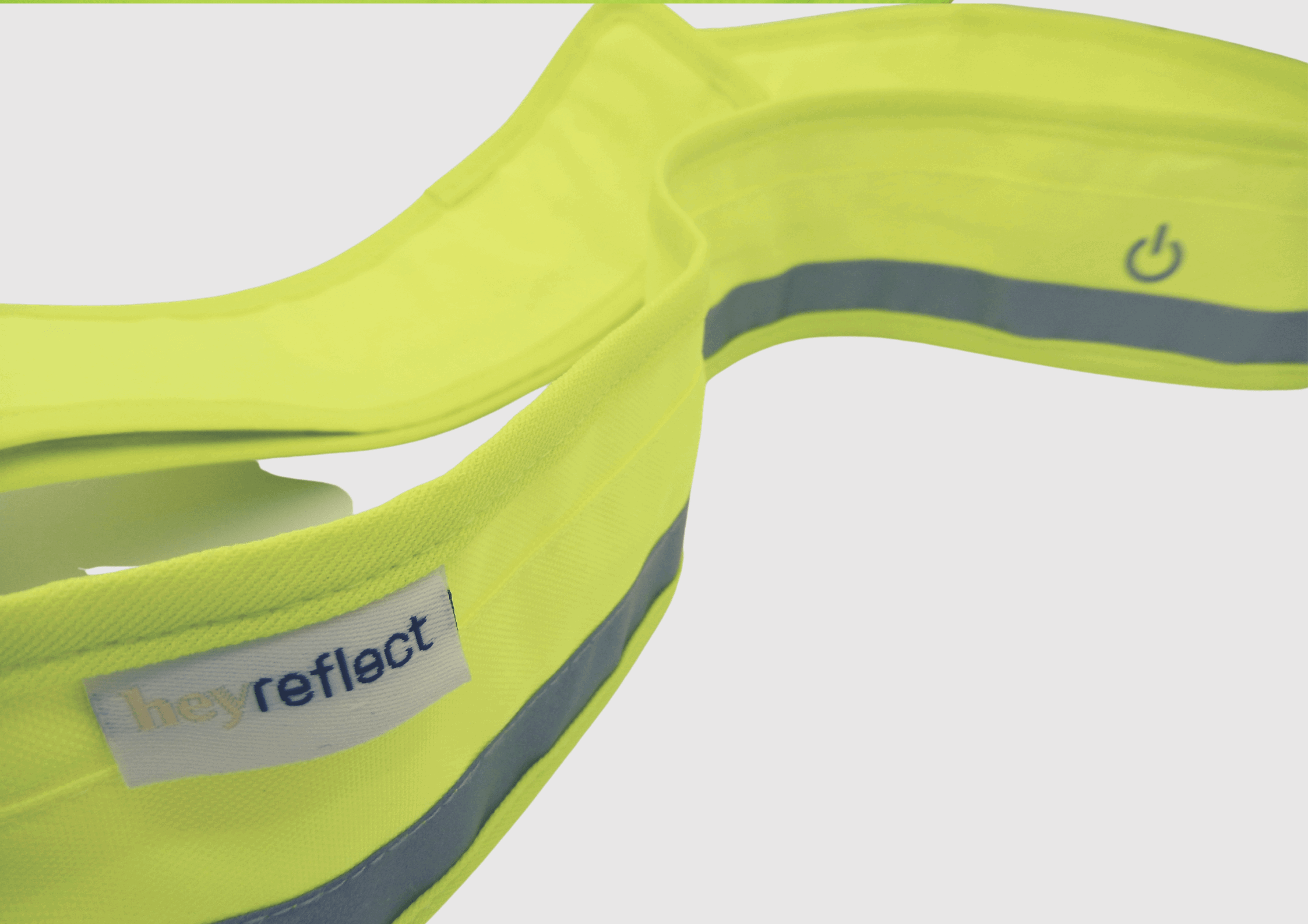 Gelber LED Gurt Detailansicht mit heyReflect Logo